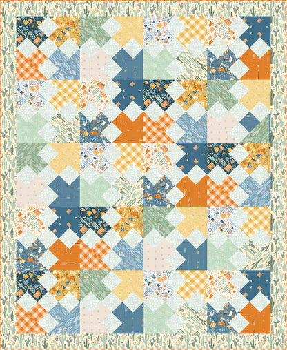 A vibrant patchwork quilt featuring squares in orange, blue, and green.