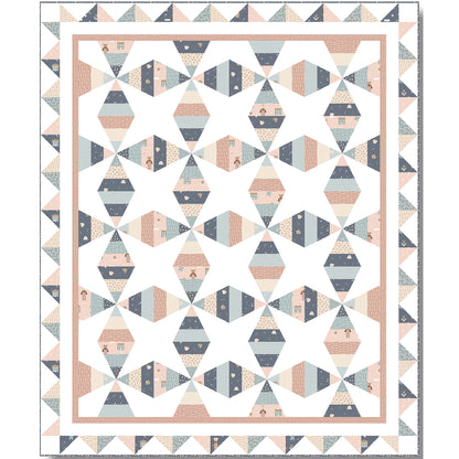 A geometric quilt featuring a vibrant pattern in muted shades of pink, blue, and gray.