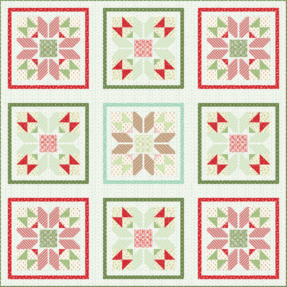 Beautiful Christmas colored quilt features nine blocks with alternating red, green, and cream fabric. There are three different block designs which have a flowery impression.