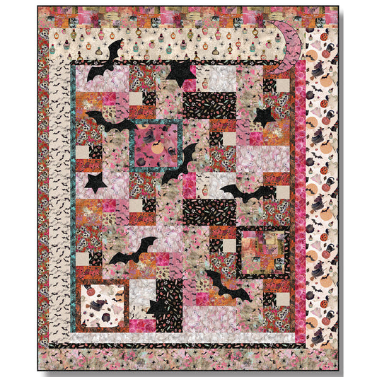 A colorful patchwork quilt featuring a design of bats, moon and star over Halloween-themed fabric.