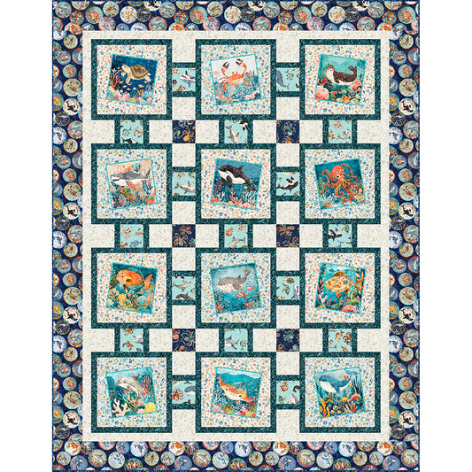 Beautiful ocean themed quilt features angled images of different ocean creatures in blocks of three by four down. Beautiful sea green mixed with other colors.