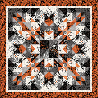 Very artistic quilt in orange, black and white which makes it feel like it's for Halloween. Very artsy with lots of shapes of color and fabric.