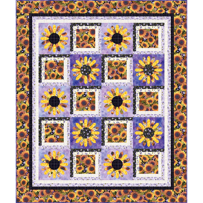 Daisy Mountain quilt is a lovely flower quilt featuring daisy fabric blocks between applique daisy blocks.