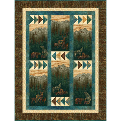 Quilt with nature-themed design featuring animals and landscapes.