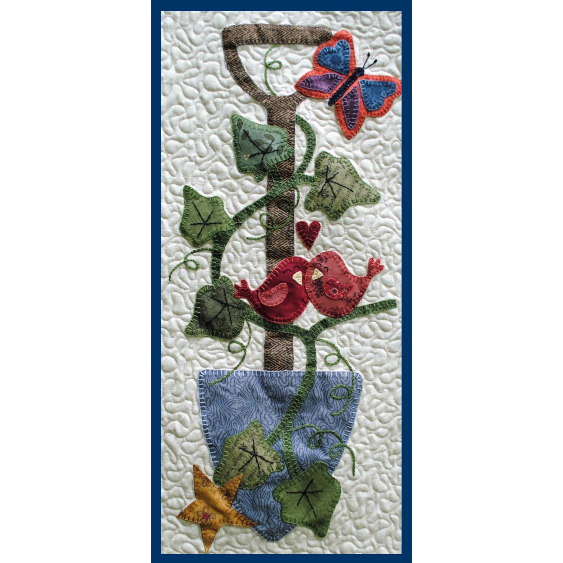 Decorative quilt with birds, butterfly, and ivy design on a textured background