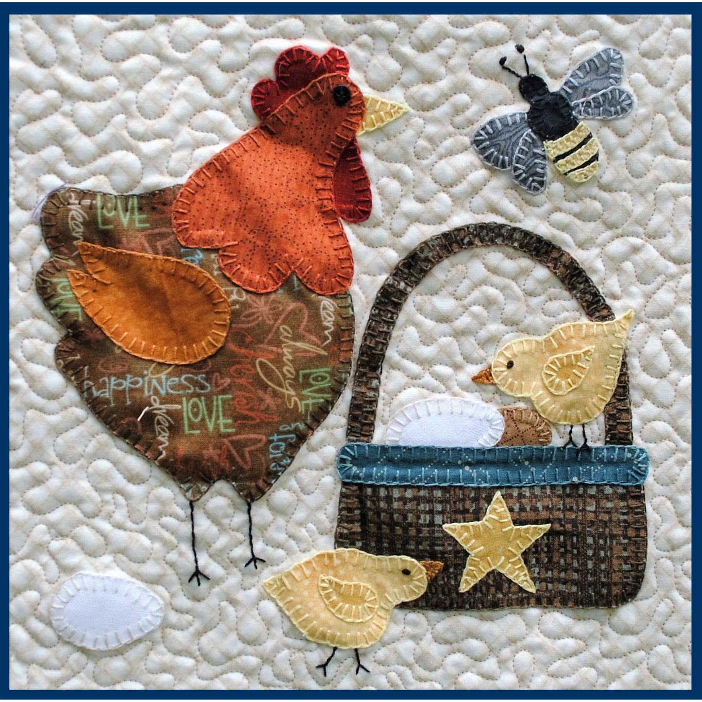 Quilt block with rooster, chicks, and bee on a textured white background