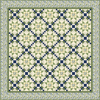 Quilt with geometric diamond pattern in green, blue, and white on a floral border