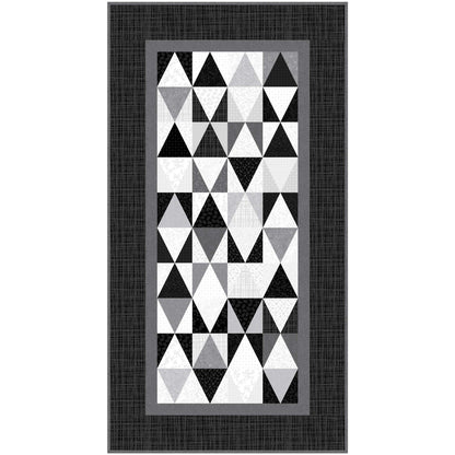 Geometric triangle patterned quilt runner with a black border on a white background