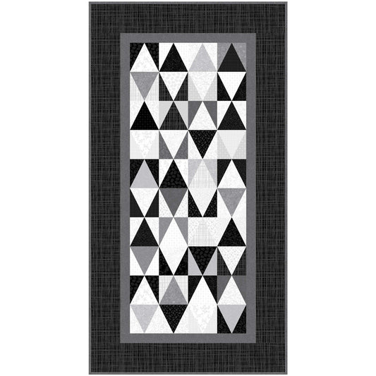 Geometric triangle patterned quilt runner with a black border on a white background